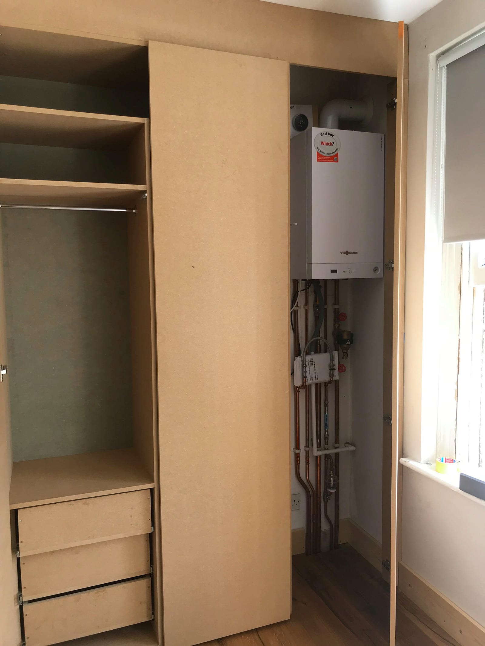 Compact single-bay shaker wardrobe in a small bedroom, Clapton Pond E5
