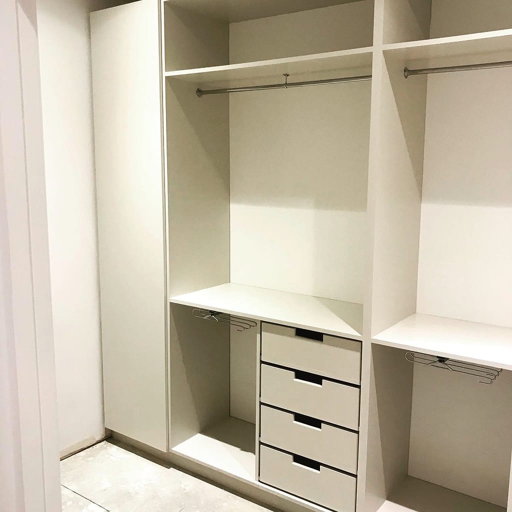Open wardrobe revealing hanging and shelf storage, Ealing W5