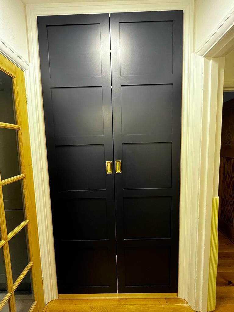 Open wardrobe revealing interior layout, Greenwich SE10