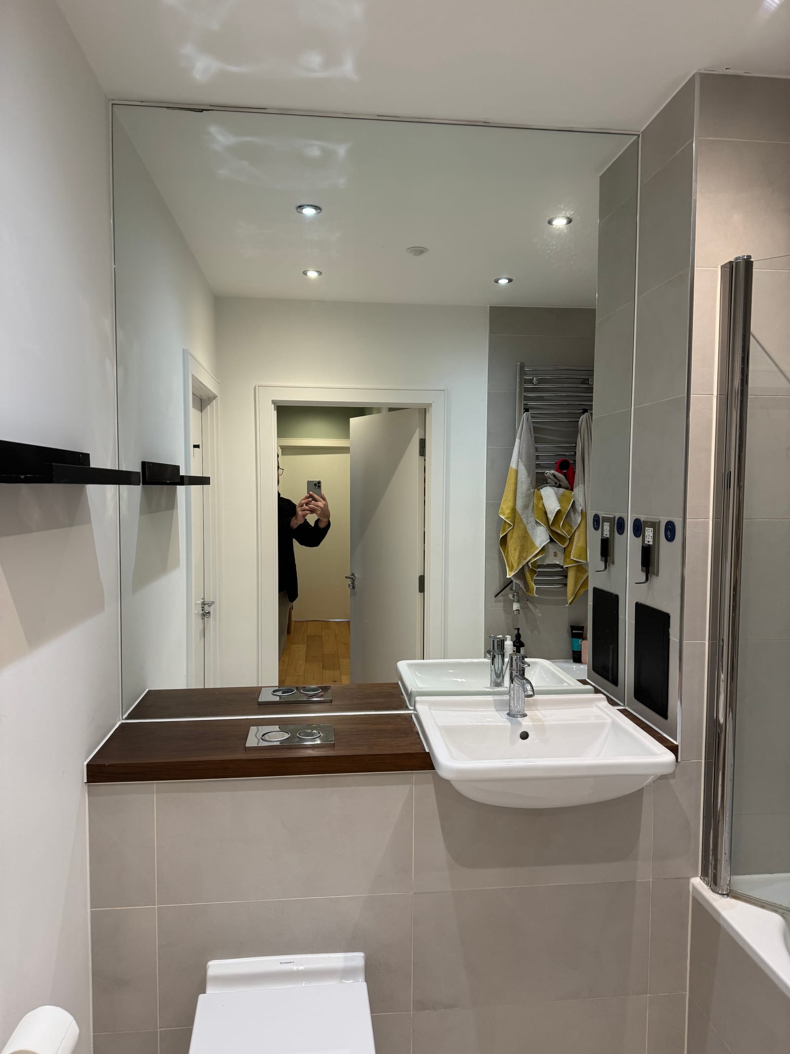 Fitted mirrored bathroom storage unit installed in Stoke Newington